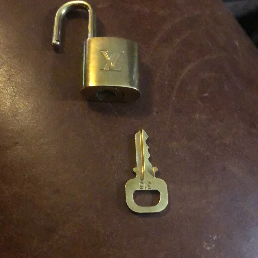 Louis Vuitton gold padlock and key set